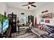Comfortable bedroom featuring a ceiling fan, neutral walls, and carpeted floor at 1880 Perch Hammock Loop, Groveland, FL 34736