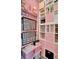 Pink closet featuring built-in shelves, drawers, and organizers for efficient storage at 1880 Perch Hammock Loop, Groveland, FL 34736