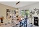 Elegant dining room featuring stylish decor, modern lighting, and easy access to the outdoor patio at 1880 Perch Hammock Loop, Groveland, FL 34736