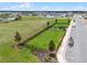 Aerial shot of the community dog park; a fenced-in grassy area for recreation at 1880 Perch Hammock Loop, Groveland, FL 34736