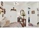 Bright foyer featuring a stylish table, decorative mirror, and a welcoming ambiance at 1880 Perch Hammock Loop, Groveland, FL 34736