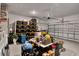 Spacious garage with ample storage shelves, providing plenty of room for vehicles and tools at 1880 Perch Hammock Loop, Groveland, FL 34736