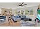 Open concept living room boasts natural light, stylish furnishings, and neutral tones for a bright and spacious feel at 1880 Perch Hammock Loop, Groveland, FL 34736