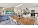 Open floorplan showcasing a kitchen, dining area, and living room with great natural light at 1880 Perch Hammock Loop, Groveland, FL 34736