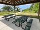 Inside a picnic shelter with tables and grills, offering shade and comfort for outdoor gatherings at 1880 Perch Hammock Loop, Groveland, FL 34736