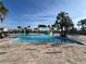 A stunning community pool with comfortable lounge chairs, a gazebo, and water features at 1880 Perch Hammock Loop, Groveland, FL 34736