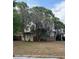 A single-story home featuring a carport and a traditional design with mature landscaping at 1909 Edwin Blvd, Winter Park, FL 32792