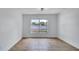 Bright and airy bedroom with a large window and tile flooring at 1965 Greenview Dr, Deltona, FL 32725