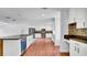 Open kitchen with stainless steel appliances and a functional center island at 1965 Greenview Dr, Deltona, FL 32725
