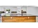 Modern kitchen featuring an island with a bamboo accent and light fixtures at 1965 Greenview Dr, Deltona, FL 32725