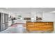 An open kitchen showcases white cabinets, stainless steel appliances, and a wood-accented island at 1965 Greenview Dr, Deltona, FL 32725