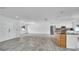 Spacious open-concept living room with neutral paint, lots of natural light, and updated flooring at 1965 Greenview Dr, Deltona, FL 32725