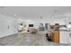 Bright open-concept living room and kitchen boast modern finishes and ample space at 1965 Greenview Dr, Deltona, FL 32725