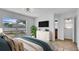 Comfortable primary bedroom offers natural light, a ceiling fan, and an attached bathroom at 1965 Greenview Dr, Deltona, FL 32725