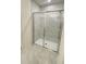 Shower enclosed with glass and marble tile with a brushed nickel shower head at 2009 Stone Wall Ct, Lake Hamilton, FL 33851