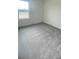 Carpeted bedroom with neutral color paint and a window overlooking the community at 2009 Stone Wall Ct, Lake Hamilton, FL 33851