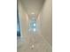 Bright hallway featuring glossy marble floors that lead to a naturally lit living space at 2009 Stone Wall Ct, Lake Hamilton, FL 33851