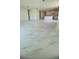 Open-concept living room and kitchen featuring sleek tile flooring and recessed lighting at 2009 Stone Wall Ct, Lake Hamilton, FL 33851