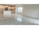 Open concept living room with an island kitchen, stainless appliances, and marble floors at 2009 Stone Wall Ct, Lake Hamilton, FL 33851