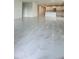 Spacious open floor plan featuring marble floors and an island kitchen with modern stainless appliances at 2009 Stone Wall Ct, Lake Hamilton, FL 33851