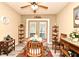 Bright dining room with a wooden table set, adjacent to the patio doors that lead to the lanai at 2102 Urbana Ave, Deltona, FL 32725