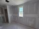 Large windows provide plenty of natural light to this room, which is ready to be customized as a beautiful bedroom at 22113 Amberbush Ct., Mount Dora, FL 32757