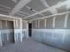 Bedroom under construction, showing framed doorways and wall finishes at 22113 Amberbush Ct., Mount Dora, FL 32757