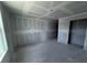 Bright room ready to be transformed into a bedroom offers unfinished walls and a view from the window at 22113 Amberbush Ct., Mount Dora, FL 32757