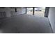 Large garage space with open doors and bare concrete, perfect for parking or a workshop, awaiting your creativity at 22113 Amberbush Ct., Mount Dora, FL 32757