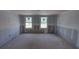 Spacious living room features natural light with bare walls, ready to be transformed into the perfect Gathering space at 22113 Amberbush Ct., Mount Dora, FL 32757