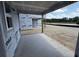 A spacious outdoor patio area, perfect for entertaining or relaxing, awaits completion with scenic views at 22113 Amberbush Ct., Mount Dora, FL 32757