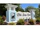 Blue Spring Reserve community sign featuring detailed heron art and lush landscaping at 222 Glass Onion Dr, Groveland, FL 34737