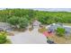 Aerial view of a beautiful home nestled in a cul-de-sac with mature trees and lush landscaping at 232 Oxford Rd, Davenport, FL 33896
