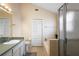 Bright bathroom featuring a bathtub with tile surround and a glass-enclosed shower at 232 Oxford Rd, Davenport, FL 33896