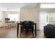 Dining room with a dark wood table and chairs, complemented by a large window at 232 Oxford Rd, Davenport, FL 33896