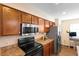 Functional kitchen featuring wood cabinetry, stainless steel appliances, and ample counter space at 232 Oxford Rd, Davenport, FL 33896