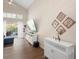 Bright living room boasts tall ceilings, modern decor, and a view to the outside patio at 232 Oxford Rd, Davenport, FL 33896
