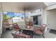 Relaxing screened patio with a cozy fire pit and comfortable seating with views of the beautiful fenced backyard at 232 Oxford Rd, Davenport, FL 33896