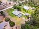 Aerial view showcases the pool, boat storage, large yard and landscaping at 23203 Outback Ln, Eustis, FL 32736