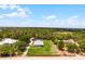Expansive estate with lush landscaping, a detached garage, and a charming single-story home on a sprawling lot at 23203 Outback Ln, Eustis, FL 32736