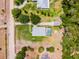 Home aerial showcasing pool, boat storage, large lot and mature trees at 23203 Outback Ln, Eustis, FL 32736