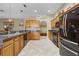 Spacious kitchen with granite countertops, stainless steel appliances, and light wood cabinetry at 23203 Outback Ln, Eustis, FL 32736