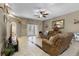 Inviting living room with tile floors, comfortable seating, and decorative accents at 23203 Outback Ln, Eustis, FL 32736