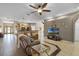 Spacious living room with open layout, comfortable leather seating, and TV area at 23203 Outback Ln, Eustis, FL 32736