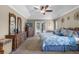 Cozy main bedroom featuring blue decor, carpet and outdoor access to patio at 23203 Outback Ln, Eustis, FL 32736