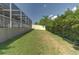 Spacious backyard featuring lush green grass and a white privacy fence at 269 Englenook Dr, Debary, FL 32713
