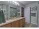 Bright bathroom with double sinks, granite counters, and modern fixtures at 269 Englenook Dr, Debary, FL 32713