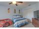 ' bedroom featuring blue and white color scheme, carpeted flooring, and closet at 269 Englenook Dr, Debary, FL 32713