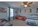 Fun ' bedroom with themed decor, carpet, and comfortable beds at 269 Englenook Dr, Debary, FL 32713