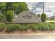 Landscaped community sign that reads The Reserve at DeBary, framed by green trees and foliage at 269 Englenook Dr, Debary, FL 32713